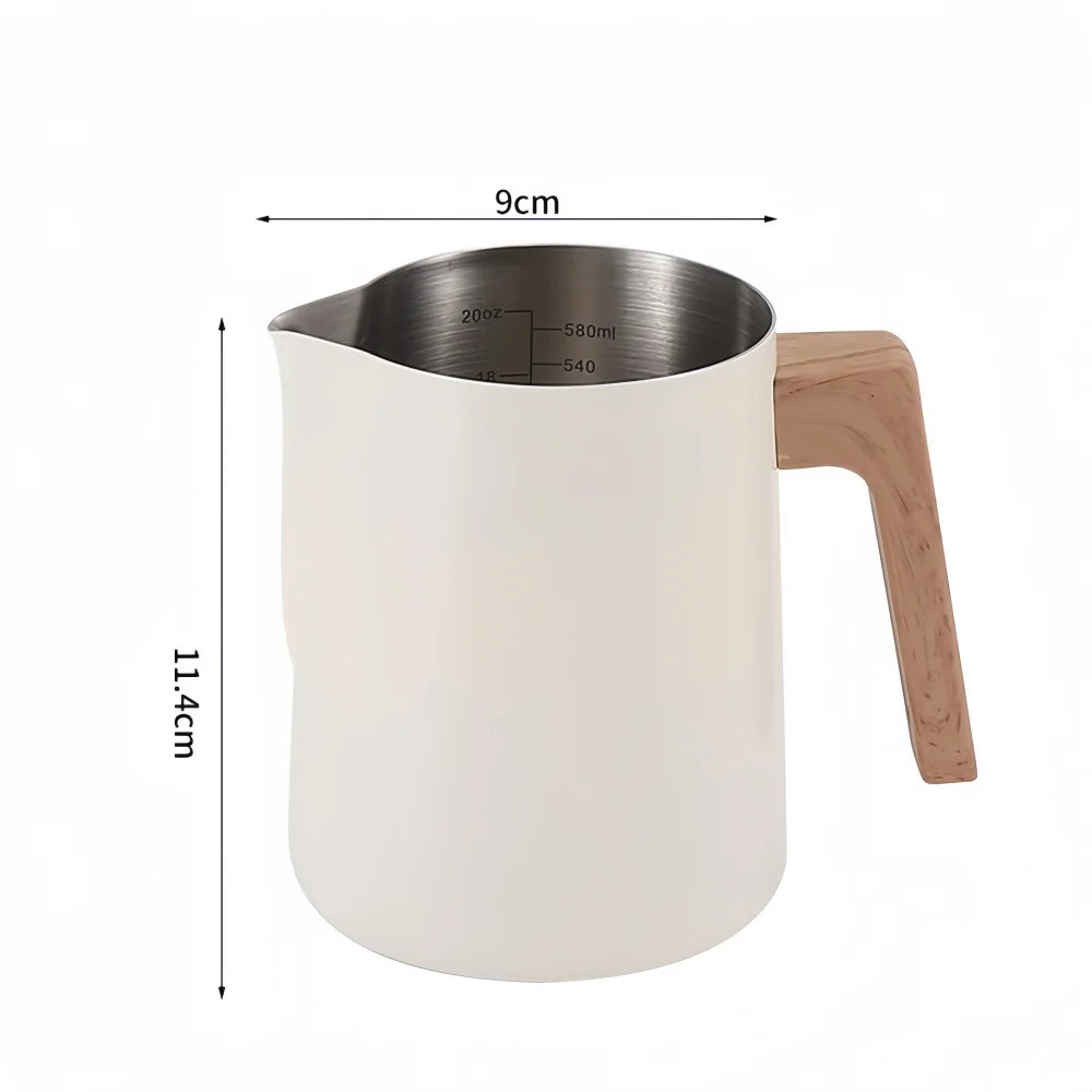 A frosted white milk pitcher with a light wood handle and stainless steel interior, shown with dimension lines indicating a height of 11.4cm, a width of 9cm, and the pitcher diameter.