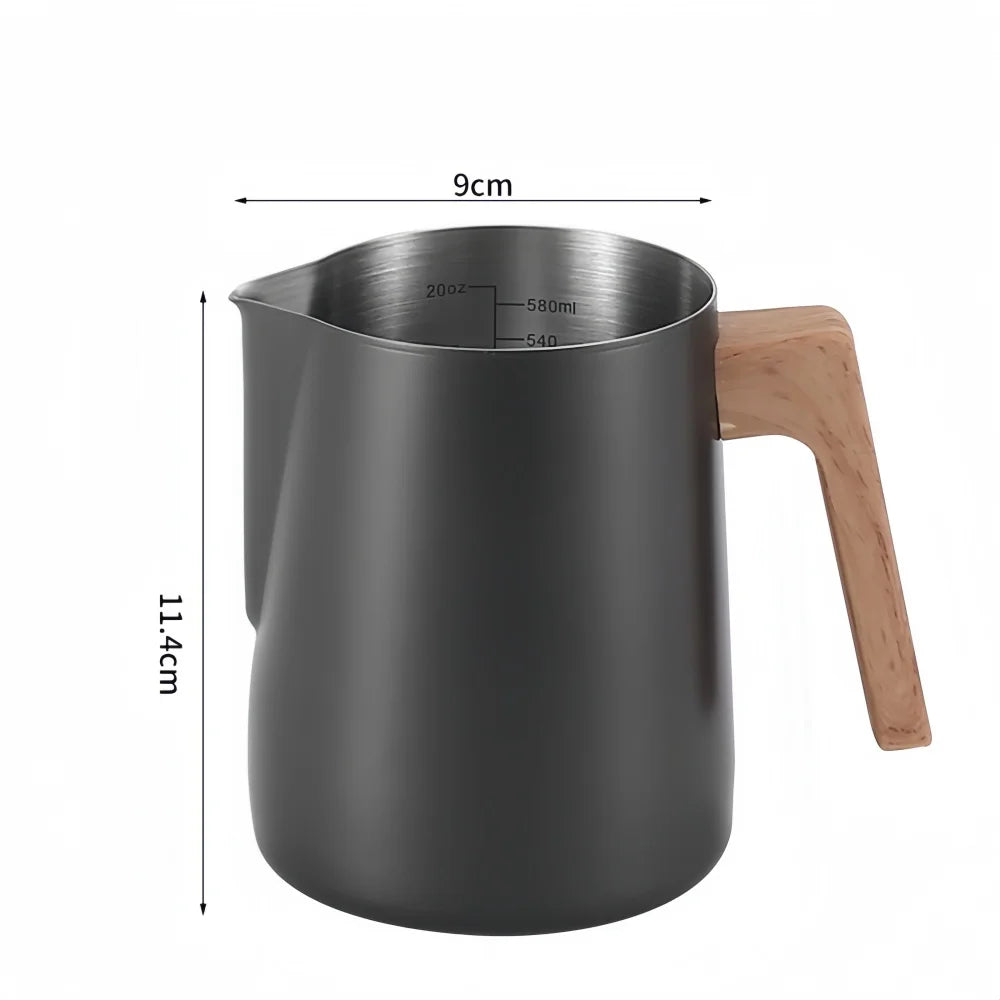 A matte dark gray milk pitcher with a light wood handle and stainless steel interior, shown with dimension lines indicating 9 cm width and 11.4 cm height.