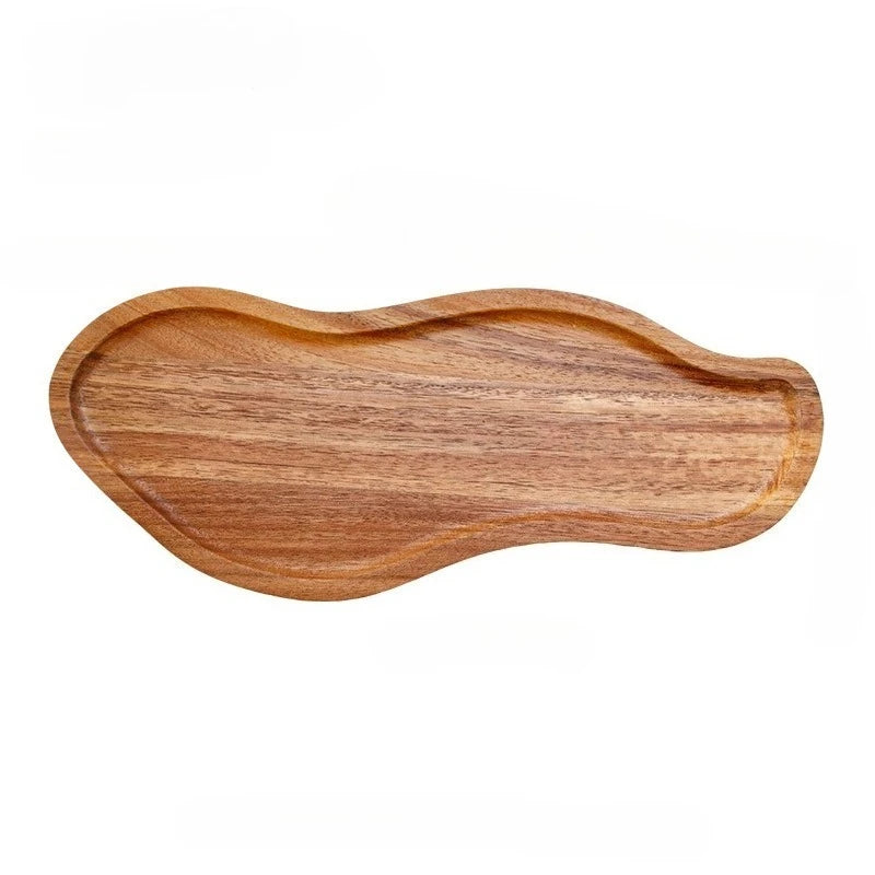 Wooden tray with wavy edge on a white background