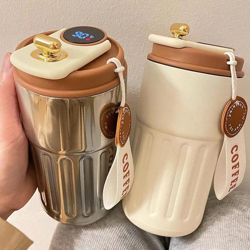 Two insulated coffee cups with digital temperature display and 'Coffee' tags on a neutral background.