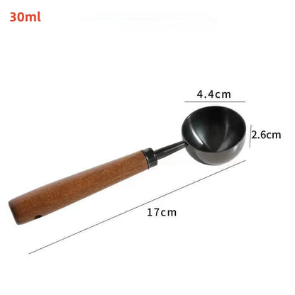 Measurement details of a wooden-handled scoop with a black bowl on a white background