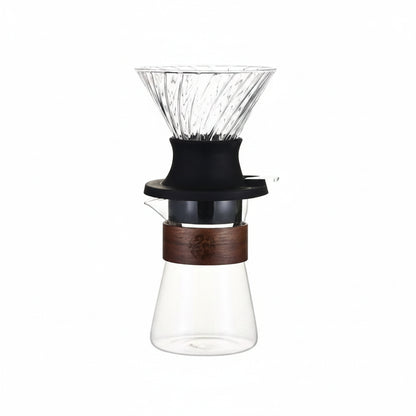 Glass coffee dripper with wooden collar.