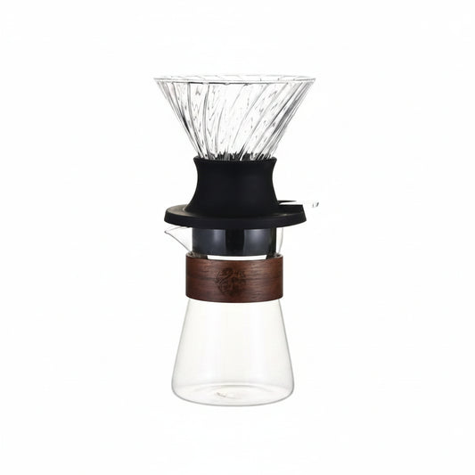 Glass coffee dripper with wooden collar.