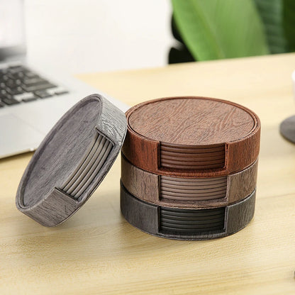 coasters with a holder on a desk.