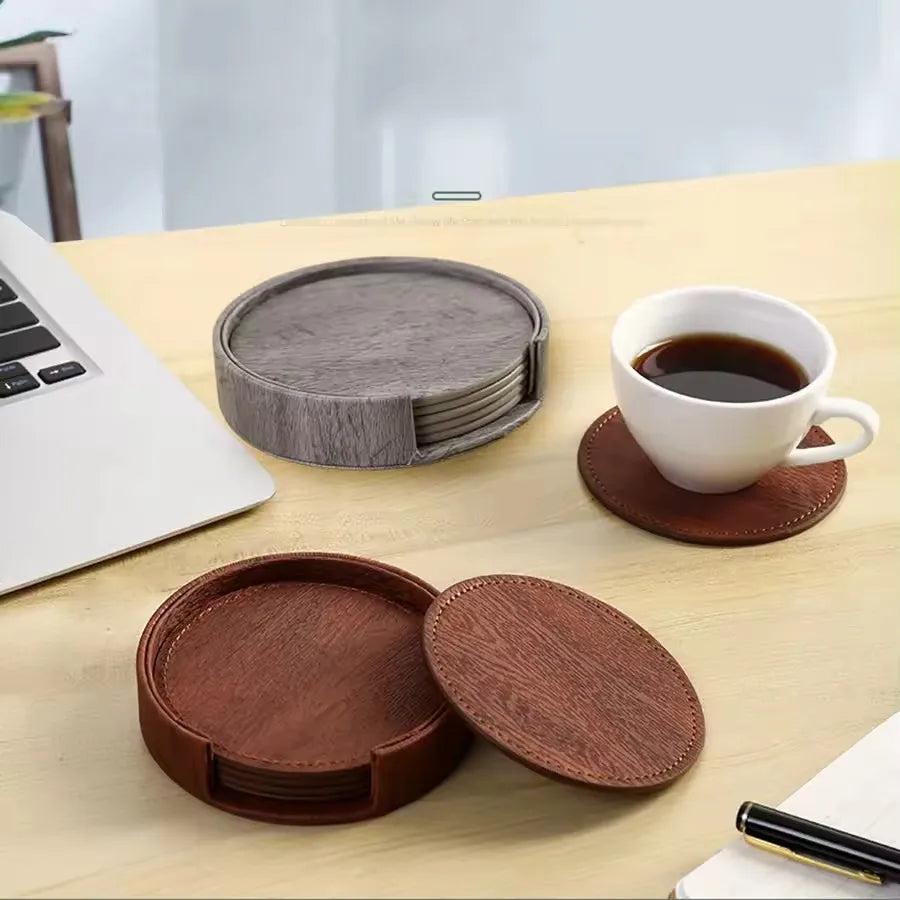 Set of wooden coasters on a desk with a laptop and cup of coffee.