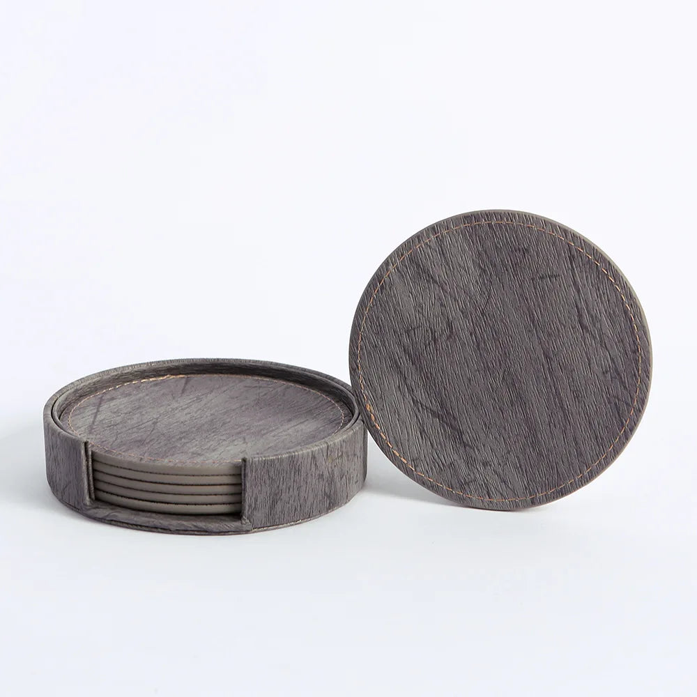 Set of round wooden coasters with a matching storage box on a white background