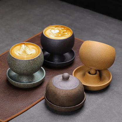 Set of ceramic coffee cups with latte art on a dark surface