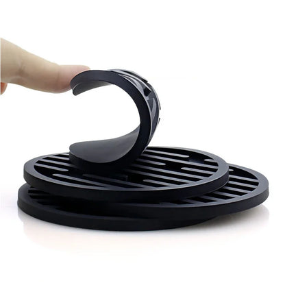 black coasters on a white background