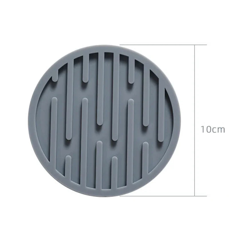 Gray silicone mat with textured design and measurement label on a white background