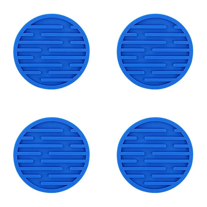 Four blue silicone trivets with textured surface on a white background