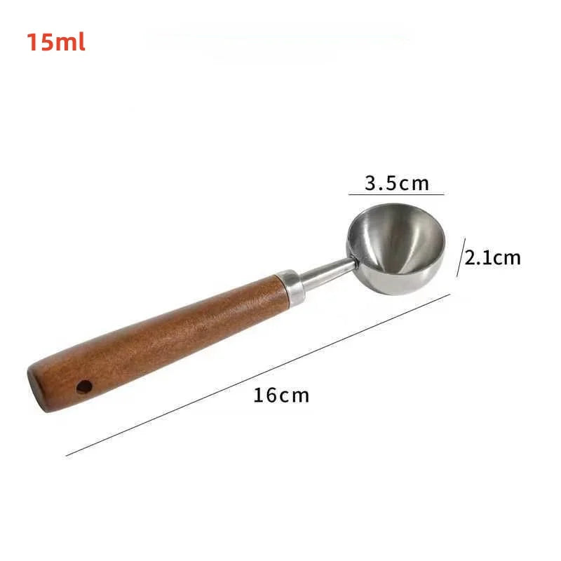 Measurement details of a metal scoop with wooden handle on a white background