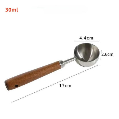 Measurement tool with wooden handle and metal scoop, showing dimensions on a white background.