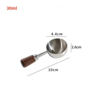 Metal scoop with wooden handle and measurements on a white background