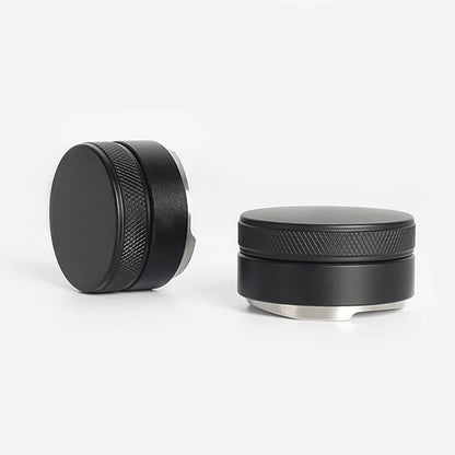 Two black metal grinder components on a white background