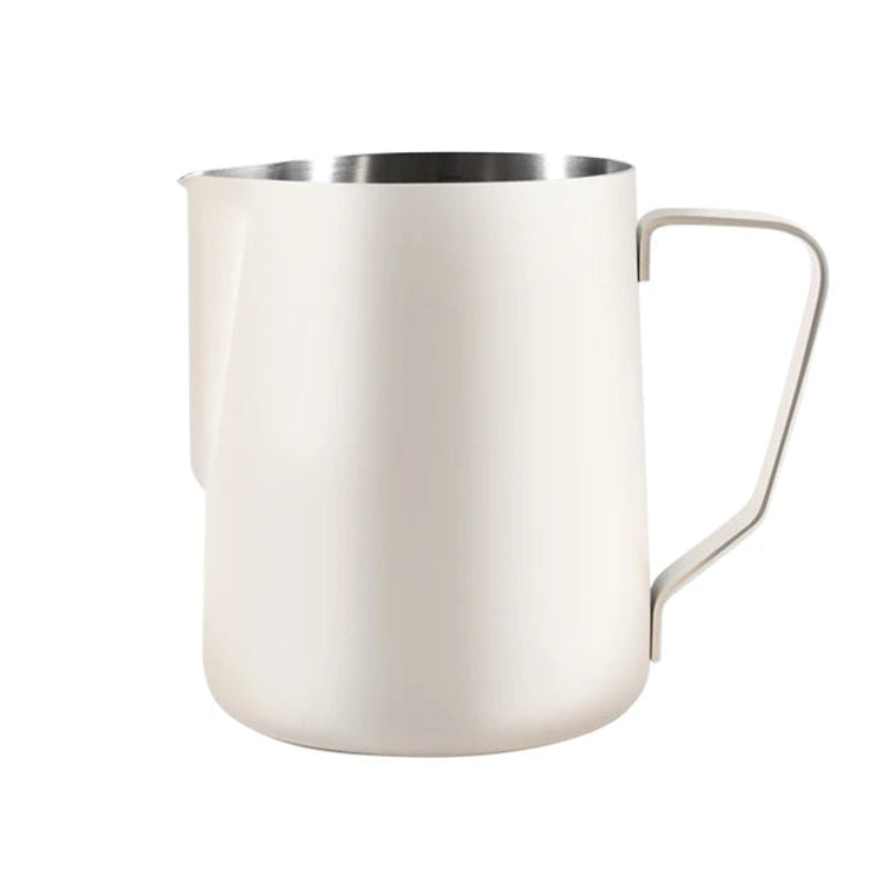 Beige milk frothing pitcher on a white background