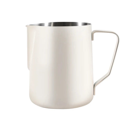 Beige milk frothing pitcher on a white background