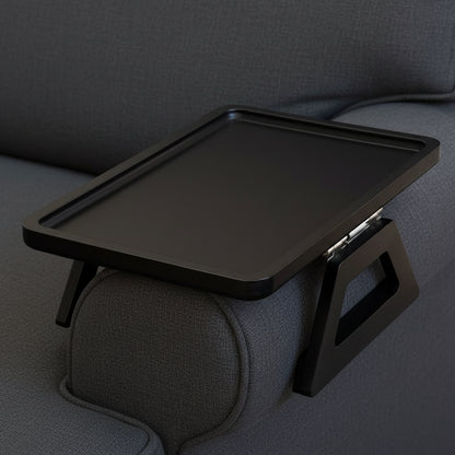 Black adjustable tray on a light gray sofa