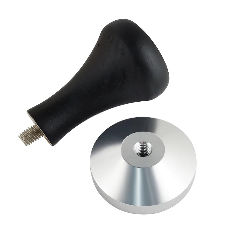 Black coffee tamper handle with metal disc on a white background