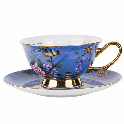 Blue floral teacup and saucer with gold accents, shown with measurements on a white background.