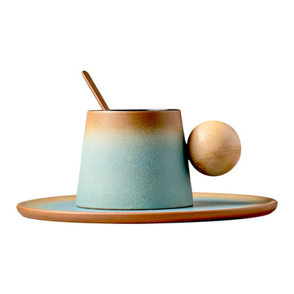 Ceramic mug with wooden handle and lid on a matching plate against a white background