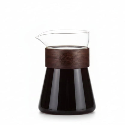 Glass carafe with wooden accent on a white background