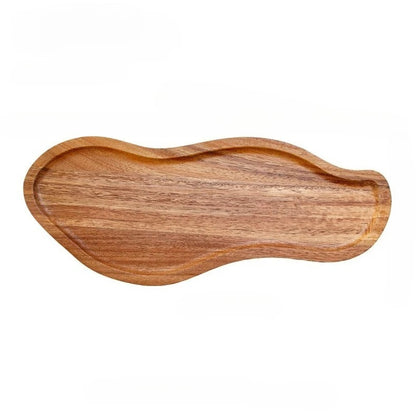 Wooden tray with wavy edge on a white background