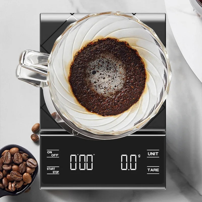 Digital kitchen scale with a glass container of coffee grounds on a light gray background