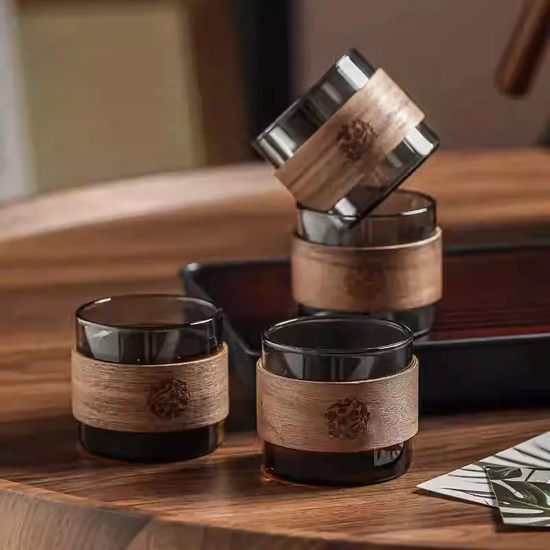 Set of glass cups with wooden accents