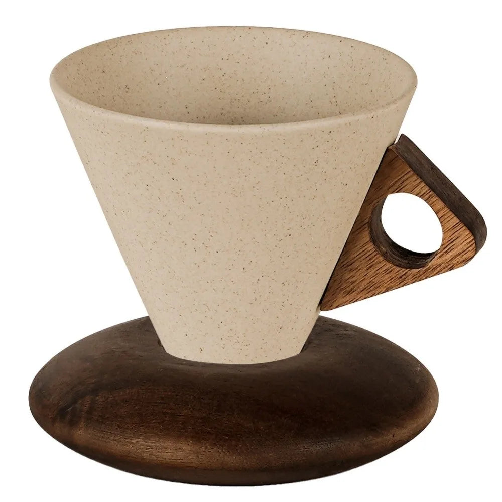 Ceramic coffee dripper with wooden handle and base on a white background