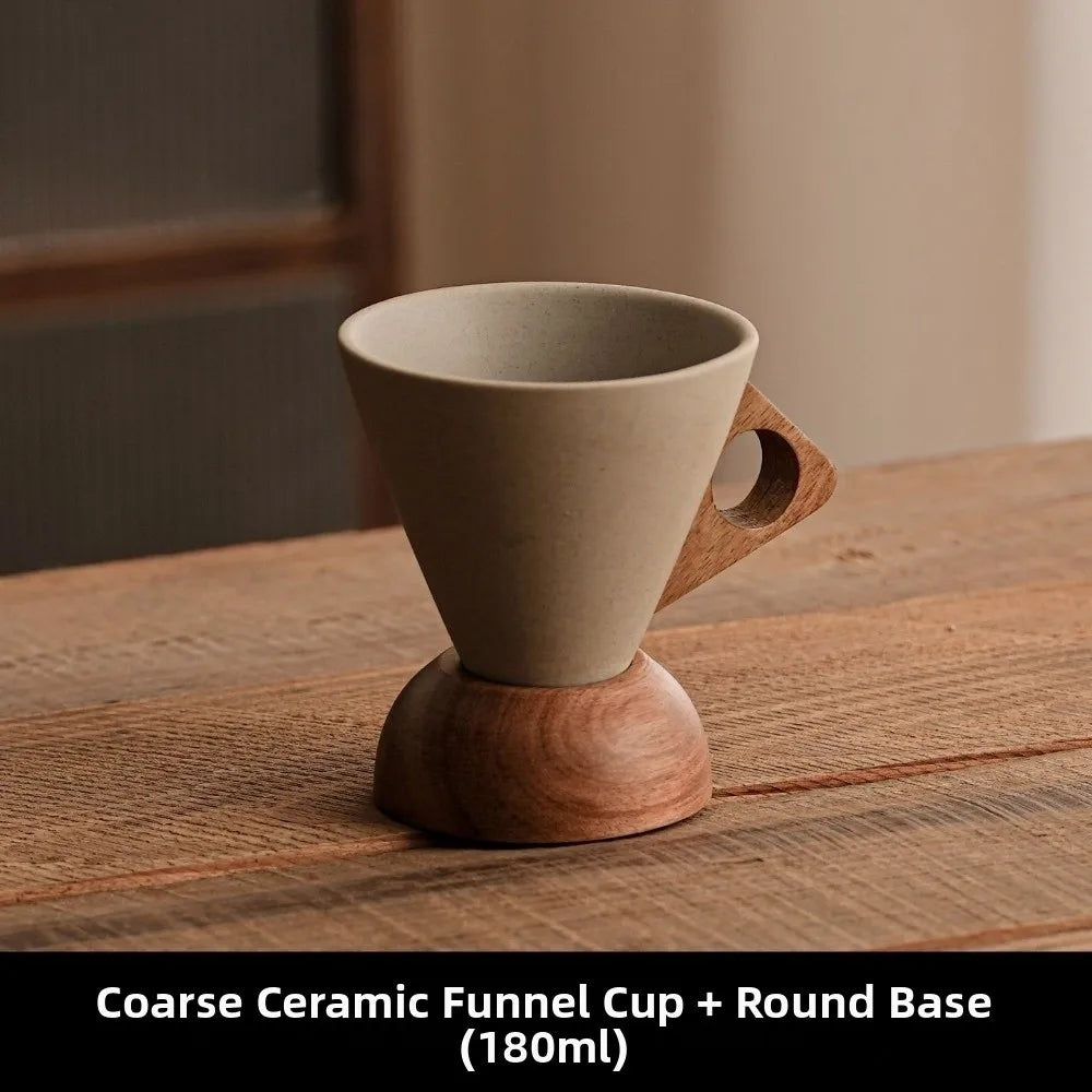 Coarse ceramic funnel cup with wooden base on a wooden surface