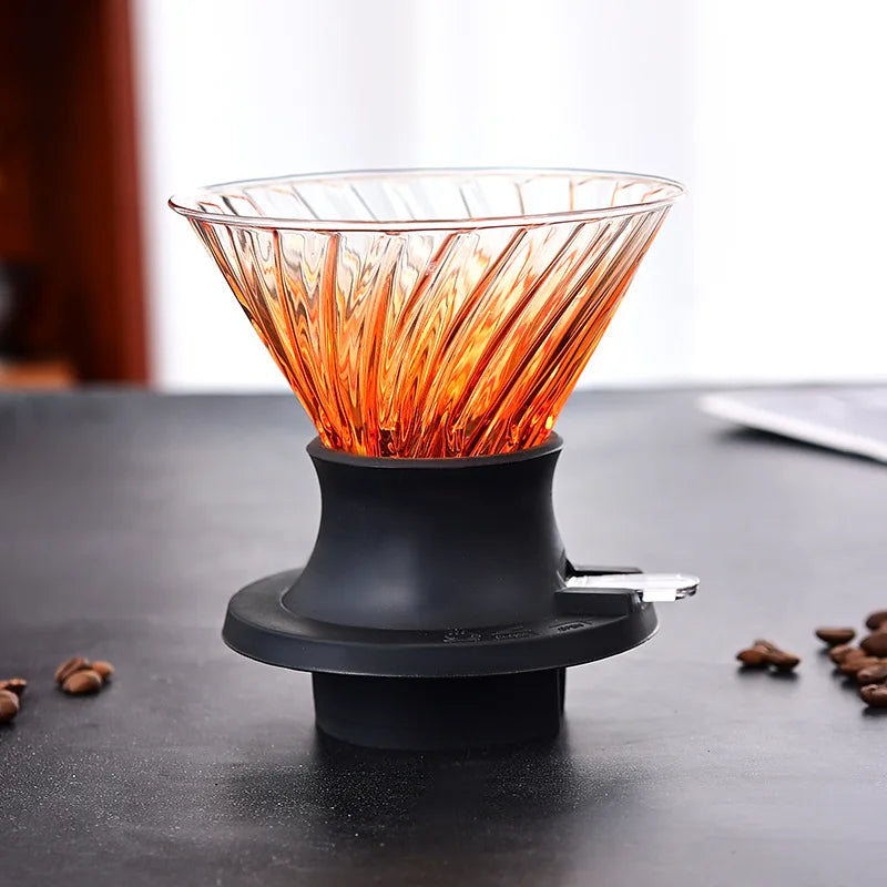 Coffee dripper with orange filter on a dark surface with coffee beans around