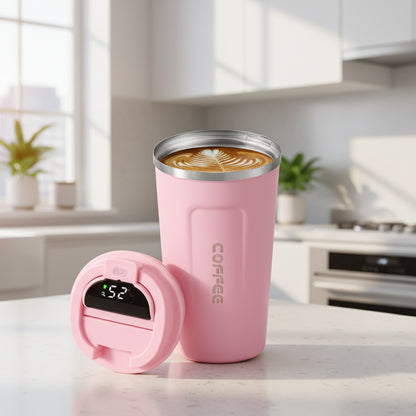 Pink insulated coffee tumbler with digital temperature display on a white background