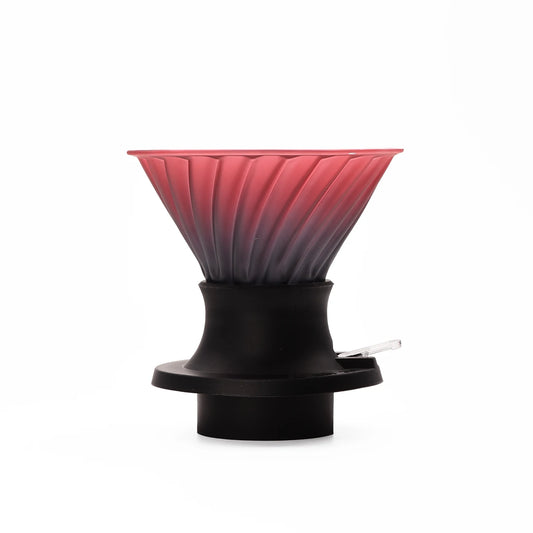 Red and black coffee filter on a white background