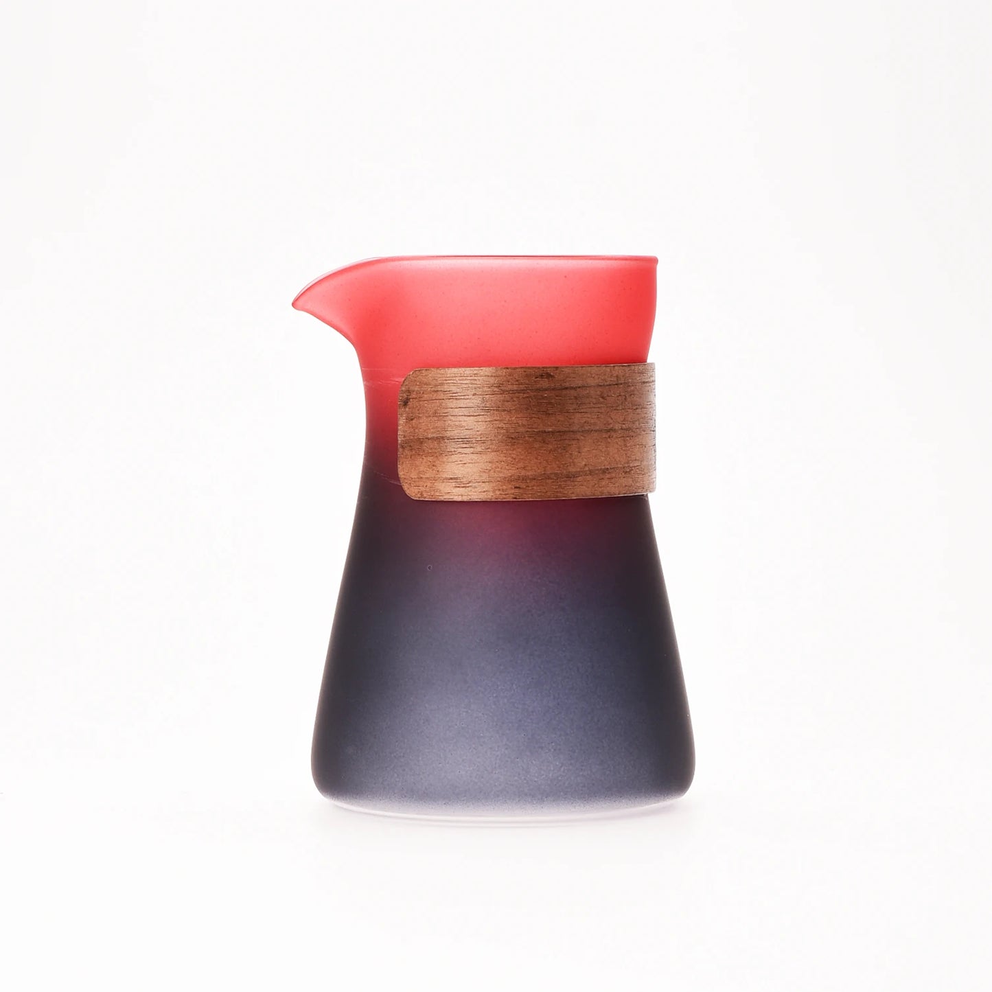 Ceramic pitcher with wooden handle on a white background