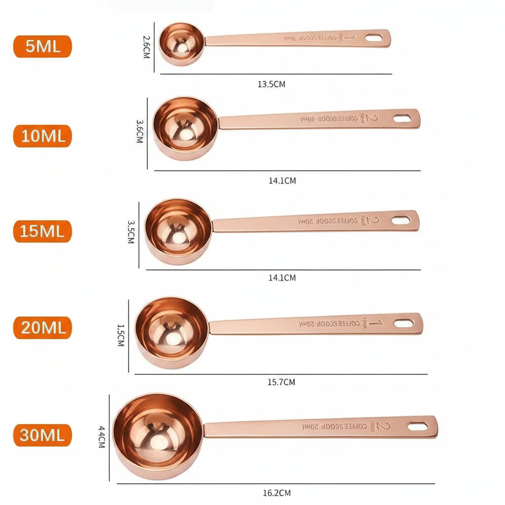 Set of stainless steel measuring spoons with measurements labeled on a white background