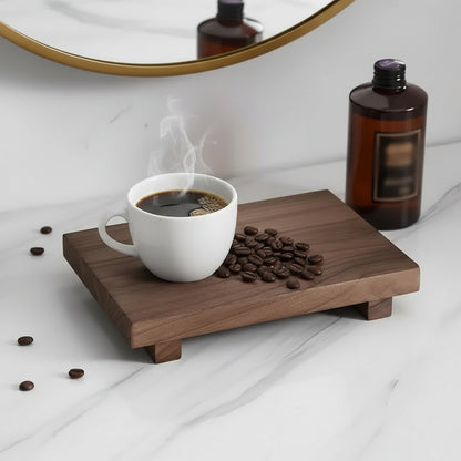 Wooden display stand with decorative items on a marble surface