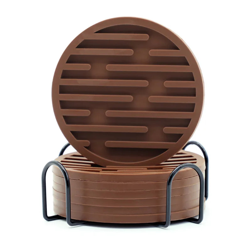 Brown circular coaster set with metal holder on a white background