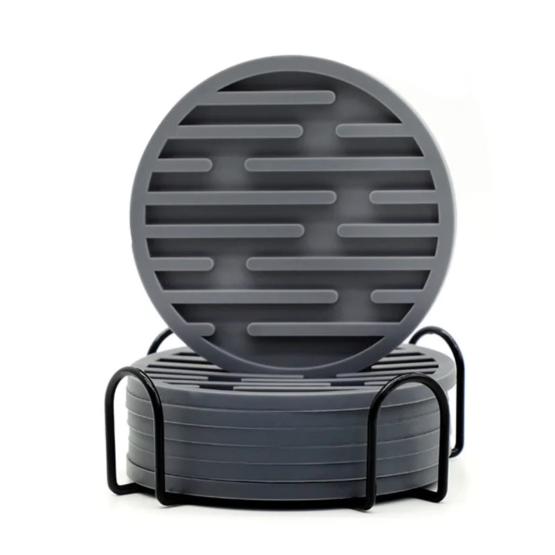 Gray silicone coasters with black metal stand on a white background