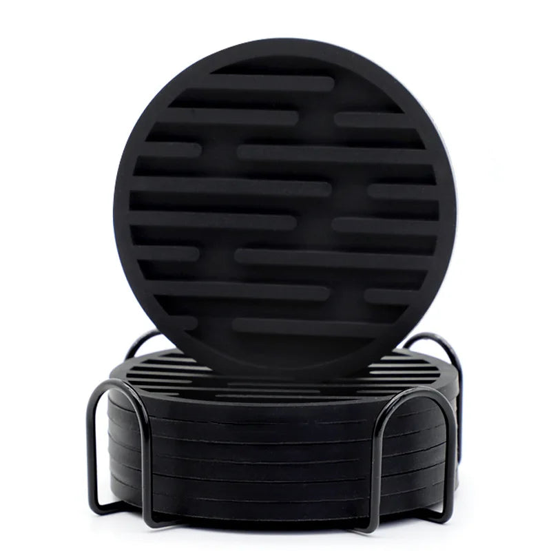 Black silicone coasters with black metal stand on a white background