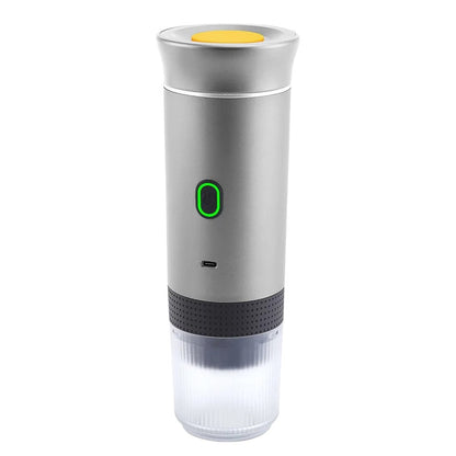 Silver and black electronic device with a green light on a white background