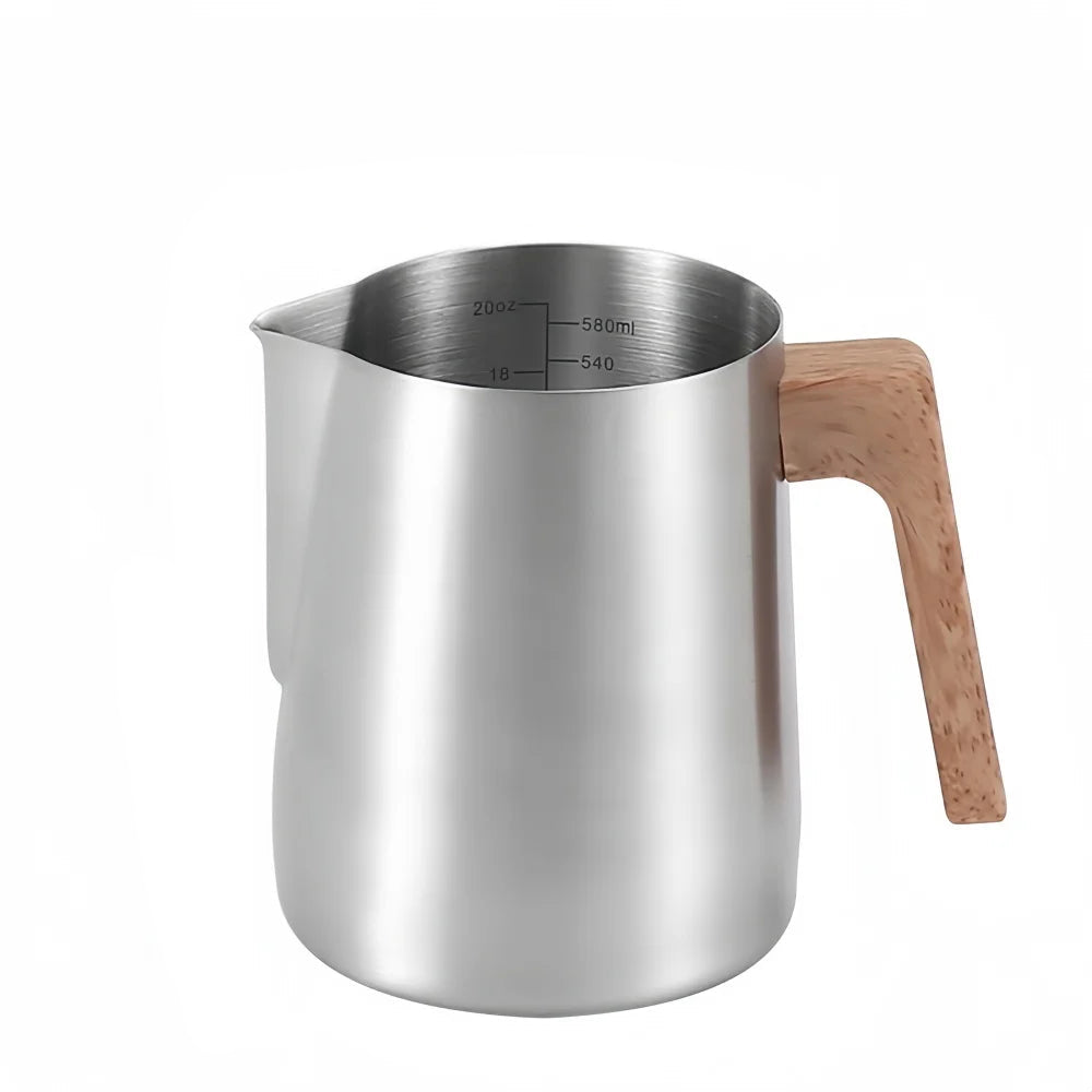 A stainless steel milk pitcher with a light brown wooden handle