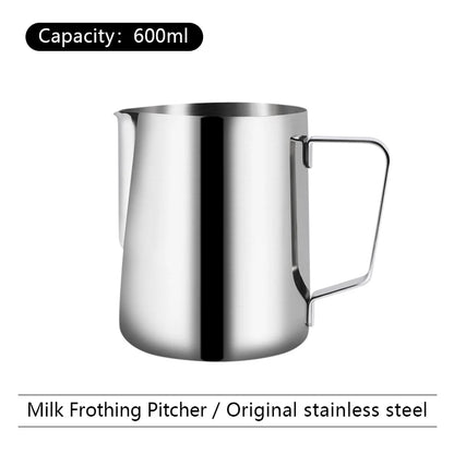 Stainless steel milk frothing pitcher with capacity label on a white background