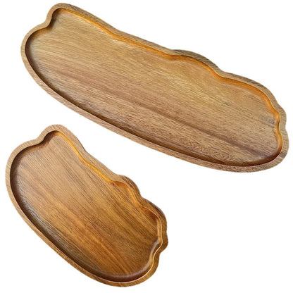 Two wooden trays with wavy edges on a white background
