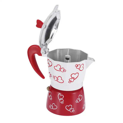 Red and white coffee maker with heart patterns on a white background