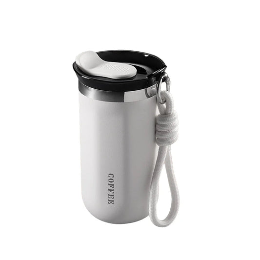 White travel mug with black lid and gray handle on a white background