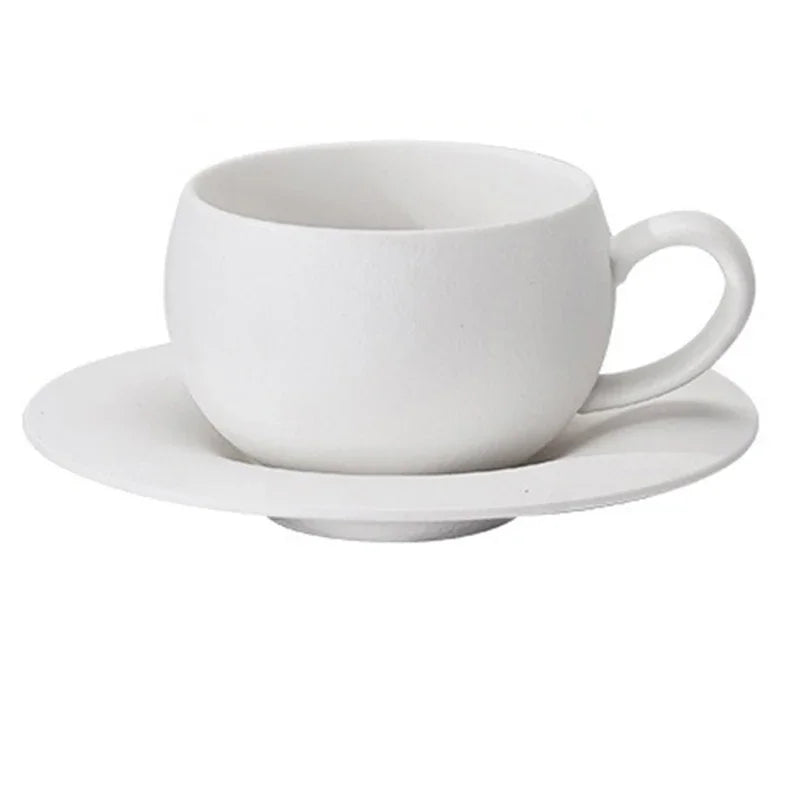 White ceramic cup and saucer on a white background