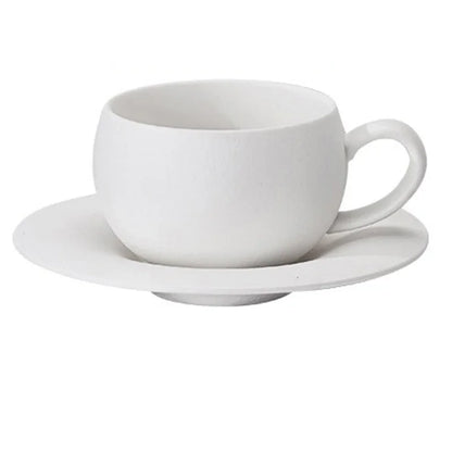 White ceramic cup and saucer on a white background
