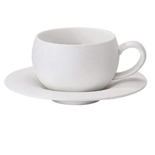 White ceramic cup and saucer on a white background