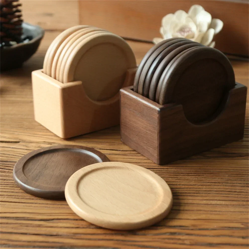 Wooden coasters in holders on a wooden surface