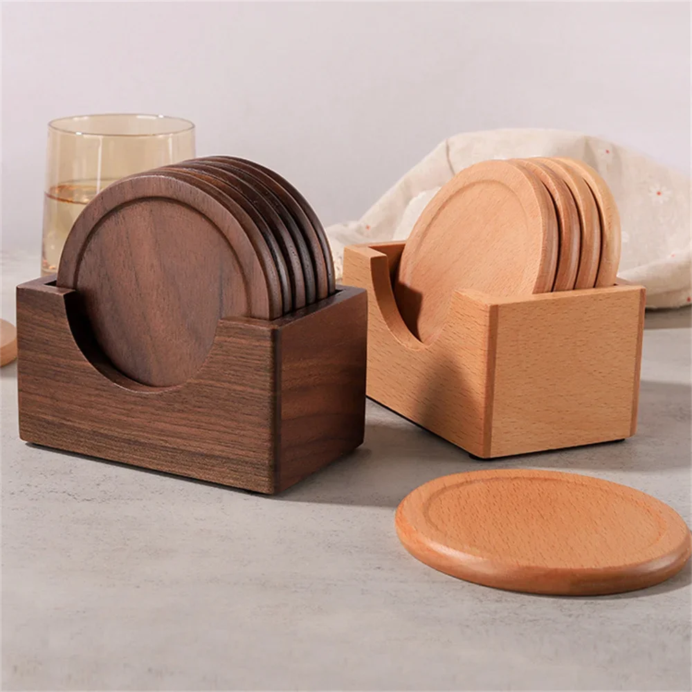 Wooden coasters in holders on a light surface